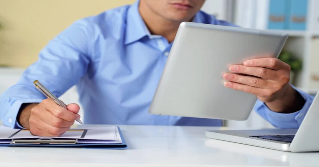 man using a tablet for injury lawyer and legal consultation