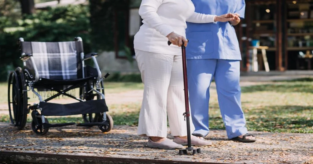 nurse helping elderly woman walk and disability legal advice Hermosa Beach