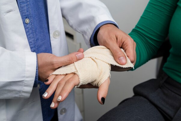 Injury Care in West Adams: Doctor Applies Bandage
