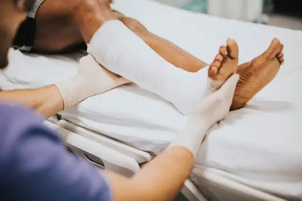 California Injury Lawyer: Doctor Applying Cast to Injured Patient