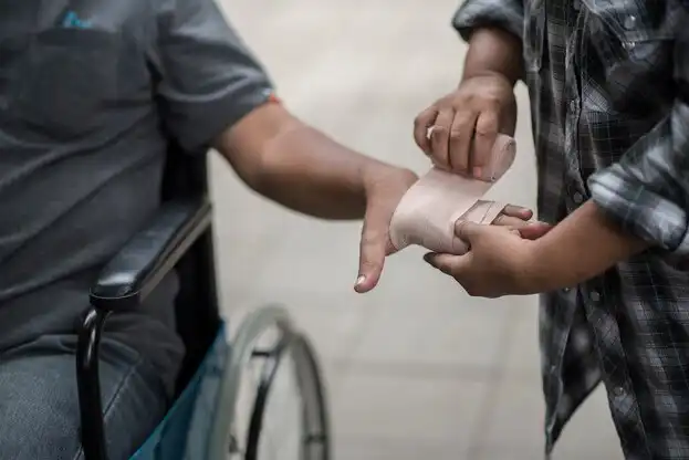 Personal Injury Recovery: Women Wrapping Hands, Men in Wheelchairs