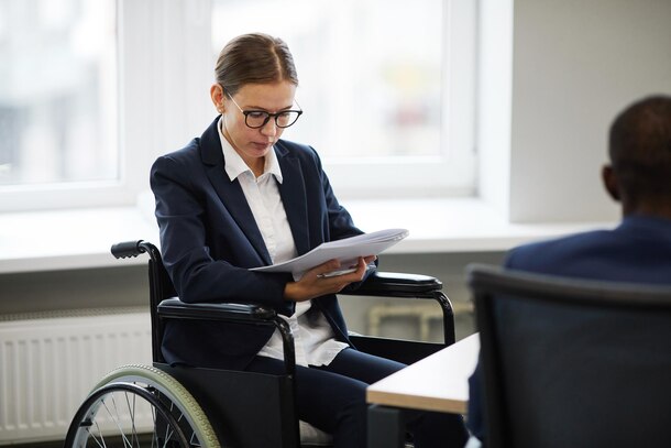 West Adams, California Personal Injury Lawyer: Woman in Wheelchair Reviews Case Documents